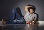 WEB-bigstock-Depressed-young-man-lying-on-f-91538753